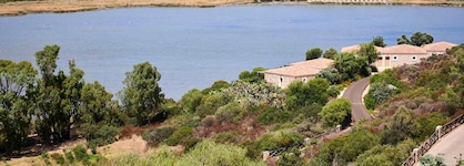 Baia di Chia Resort Sardinia, Curio Collection by Hilton